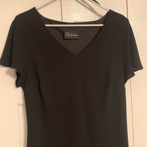 Beautiful black cocktail dress with beading on bottom.  Worn only 2x